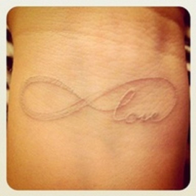 Wonderful White Ink Love Quote Tattoo On Wrist